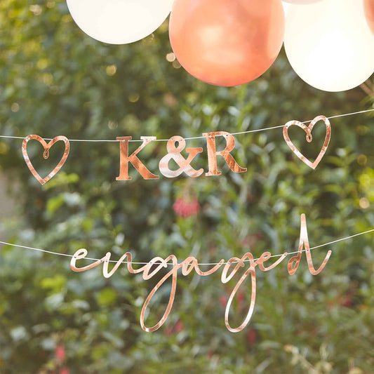 customised engaged bunting, engagement party banner with initials, rose gold engagement decorations, personalised engagement bunting, engaged bunting with hearts, wedding decoration ideas, custom engagement banner, rose gold twine party decorations, engagement backdrop decor, bridal shower engagement banner, engagement celebration decor, personalised wedding decorations, unique engagement party banner, romantic engaged bunting, custom initials party decor, rose gold heart bunting, engagement party decor Aus