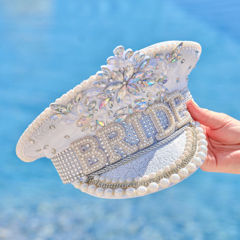 bride hat multi-coloured, embellished bride hat, hen party bride hat, rhinestone bridal hat, festival style bride hat, bachelorette accessories Australia, bride hat with gems, Instagrammable hen party hat, statement bridal hat, colourful bride hat, bride party headwear, bold bride hat, hen do party accessories, white hat with embellishments, hen night bride hat, bride to be hat Australia, bridal shower photo prop, fun bride party hat, bride costume hat, standout bride hat