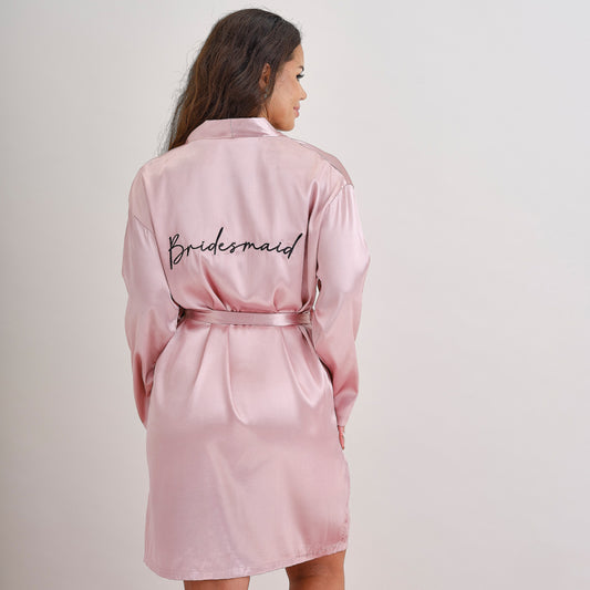 bride dressing gown, hen party robe, white bride robe Australia, embroidered bride gown, Ginger Ray dressing gown, bridal robe black embroidery, wedding morning robe, bride getting ready gown, hen party essentials, stylish bride robe, elegant bridal robe, soft white dressing gown, hen party outfit, bride robe Australia, bride robe one size, bachelorette party gown, Ginger Ray Australia stockist, bridal shower robe, bride to be robe, wedding prep robe, Carseldine party supplies