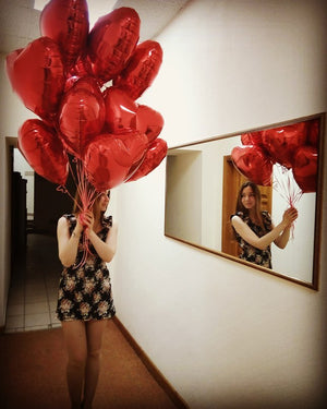 Girl Holding 18 inches red heart balloons